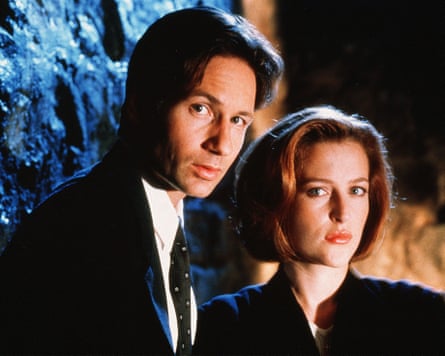 Duchovny as Fox Mulder with Gillian Anderson as Dana Scully in The X Files.