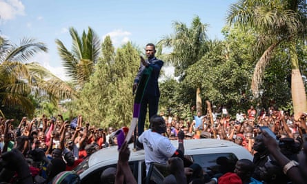 Ugandan pop star turned opposition MP, Robert Kyagulanyi, delivers a speech outside his home in Kampala on his return from the US on 20 September.