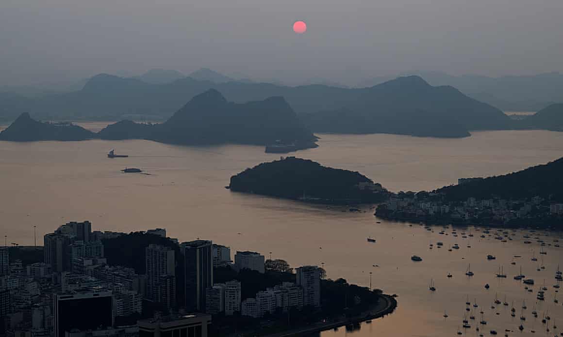 The sun rises amid smoke from Amazon wildfires at Guanabara Bay
