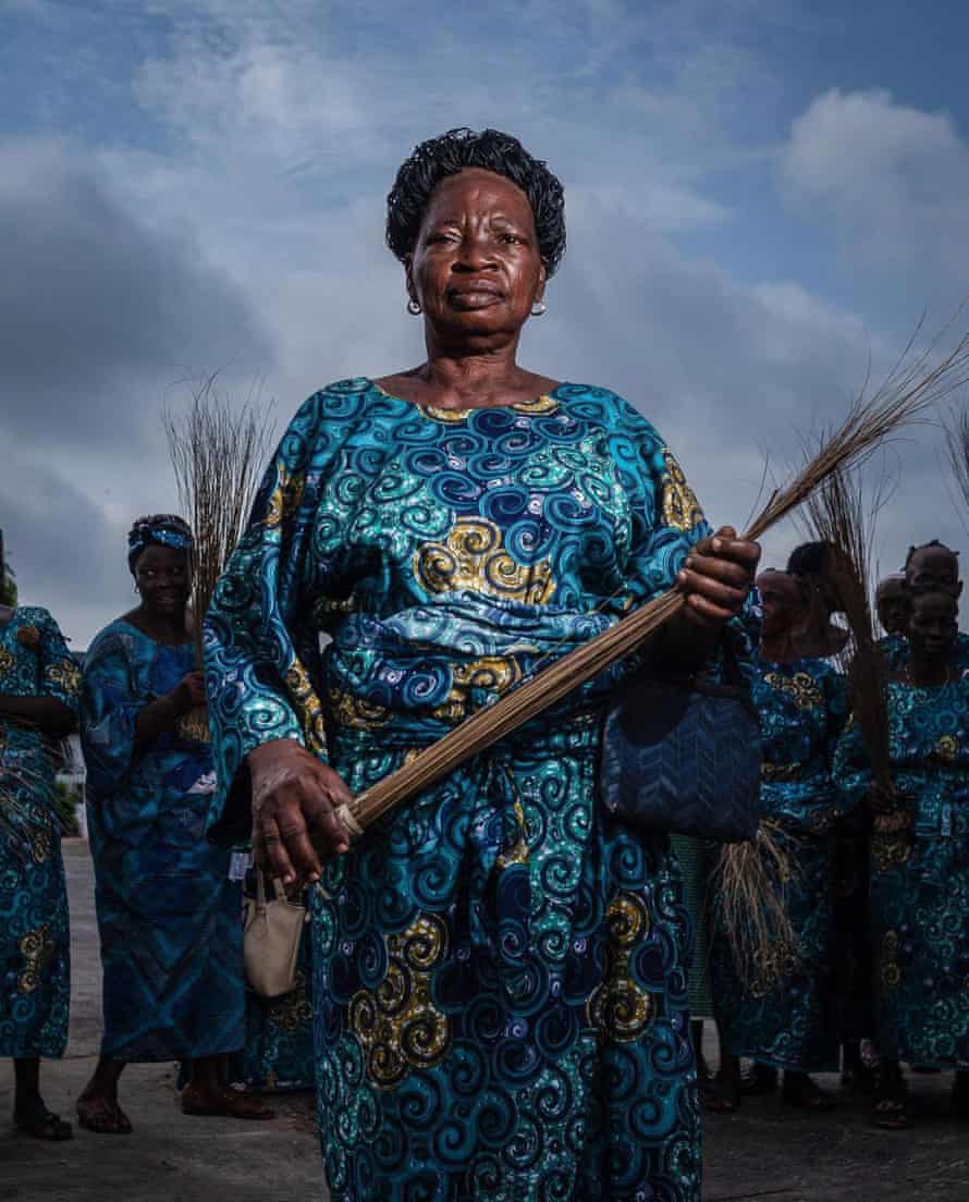 Iyawo Ile Oba (King household wives) in one of their societal forms where their duty is to sweep the palace every year. The importance of this is to make the palace neat for the festival and also thank God for another celebration year. September, 2021. Ile-Ife, Nigeria.