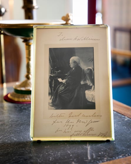 A framed card from Queen Victoria was placed nearby.