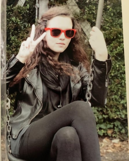 Maeve Boothby O’Neill sitting outdoors on a swing.