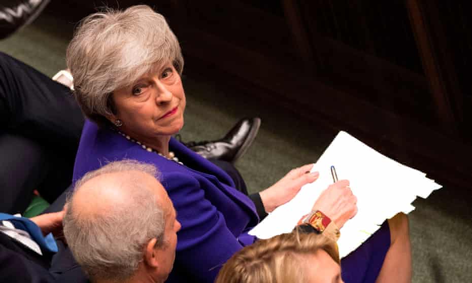 Theresa May listening to a question during PMQs in the House of Commons
