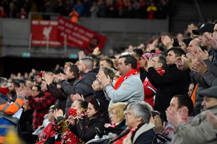 Soccer fans applaud on the seventh minute for Manchester United’s Cristiano Ronaldo and his family during the match between Liverpool and Manchester United in April 2022