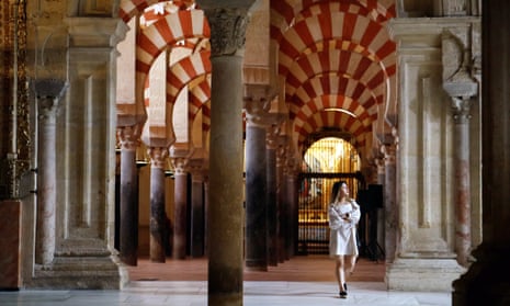 A visitor walks through Córdoba’s mosque-cathedral.