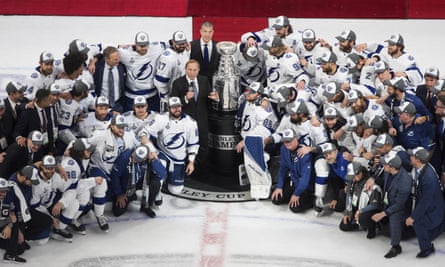 Tampa Bay Lightning players surround NHL commissioner Gary Bettman after winning the Stanley Cup