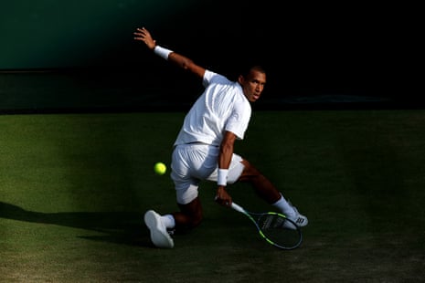 Felix Auger-Aliassime plays a backhand