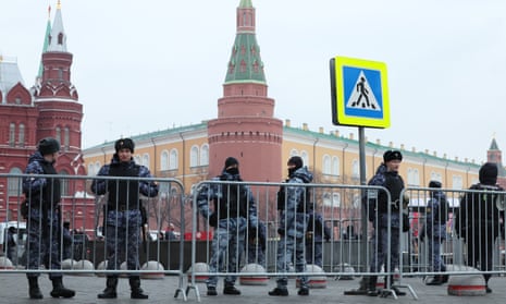 Law enforcement officers stand guard by metal barriers set outside the Kremlin during a rally and a concert celebrating the 10th anniversary of Russia’s annexation of Crimea held at Red Square.