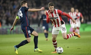Atletico Madrid’s midfielder Gabi and PSV Eindhoven’s midfielder Marco van Ginkel fight for the ball.