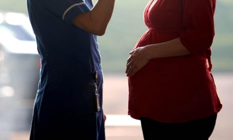 Pregnant woman and nurse