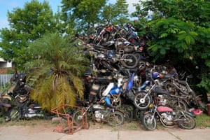 Asunción, Paraguay. A pile of motorcycles that were seized by police for allegedly being stolen