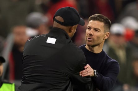Xabi Alonso embraces Vincent Kompany after the 1-1 draw at the Allianz Arena.