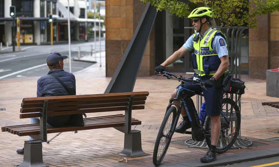 A police officer talks to a member of the public during the first day of a nationwide lockdown to stop the spread of Covid-19,