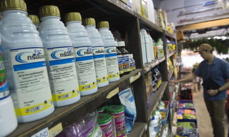 Bottles of paraquat are displayed for sale at a gardening shop in Bangkok. Thailand is banning this and other chemicals from 1 December despite US pressure.