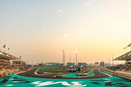 Nico Hülkenberg of Germany driving the Sauber with Lando Norris of Great Britain driving the McLaren during practice for the F1 Grand Prix of Abu Dhabi at Yas Marina Circuit