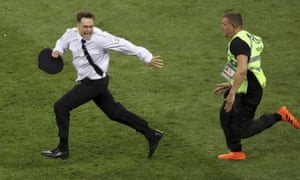 Pyotr Verzilov runs from an officer