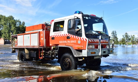 An SES vehicle amid flood waters in the NSW town of Forbes on Sunday morning.