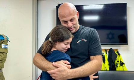 Hila Rotem Shoshani,embracing her uncle at a hospital in Israel after being released by Hamas