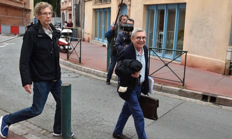 Gilles Bertin, left, who took part in the robbery of a Brink’s storage in April 1988 in Toulouse, and his lawyer Christian Etelin, walk towards the court in Toulouse on Wednesday.