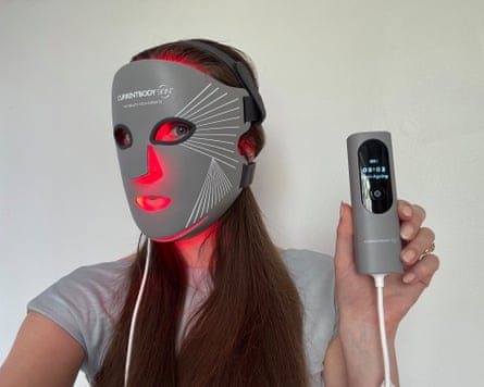 The writer wears a Currentbody LED mask
