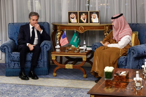 Saudi foreign minister Prince Faisal bin Farhan (R) meeting US secretary of state Antony Blinken in Jeddah, on Wednesday. Both are sat down in dark blue armchairs with their countries flags displayed on a table between them.