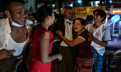 A man is reunited with his family members outside the Insein prison in Yangon.