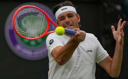 Taylor Fritz plays a return to Jordan Thompson during their fourth round match at Wimbledon.