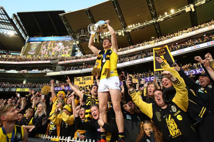 Jack Riewoldt of the Tigers celebrates with fans.