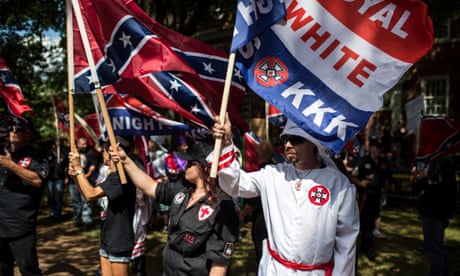 people wave confederate flags and one saying 'white' and 'kkk'