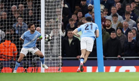 Bernardo Silva of Manchester City makes a clearance on the goal line which was ruled handball.