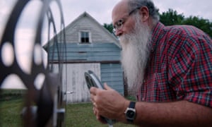Michael Zahs examining film reel