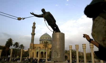 Statue of Saddam Hussein is being pulled down.
