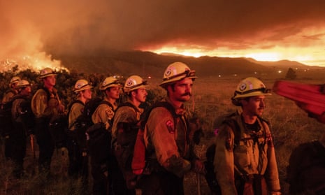 Firefighters monitor the Sugar fire, part of the Beckwourth Complex fire, in Doyle, California.