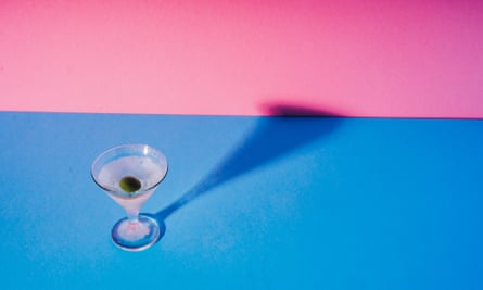 A tiny martini cocktail casts a long shadow