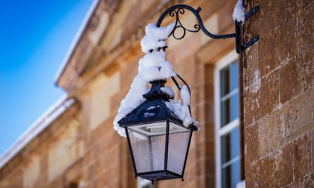 A wall mounted lamp with snow on it at Hillsborough Castle