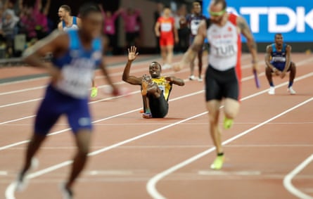 Usain Bolt falls to the ground after pulling up injured in the men’s 4x100m final in London.
