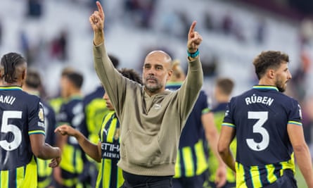 The Manchester City manager, Pep Guardiola, celebrates after the Premier League win against West Ham.