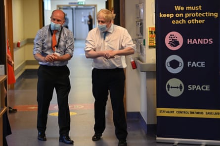 Nick Hulme with the then prime minister, Boris Johnson, at Colchester hospital during the Covid pandemic, May 2021.