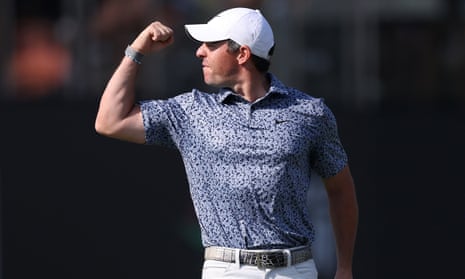 Rory McIlroy celebrates victory on the final hole of the Dubai Desert Classic.