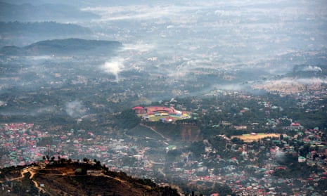 Fires from burning stubble in the fields are seen next to the cricket stadium in Dharmsala, India.