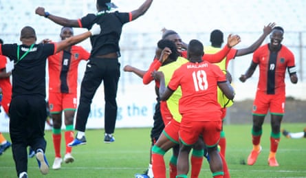 Malawi celebrate after a 1-0 victory over Uganda sealed their place at Afcon.