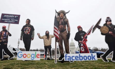 An art installation protest by the organization SumOfUs portrays Sundar Pichai, Jack Dorsey and Mark Zuckerberg as 6 January rioters near the US Capitol.