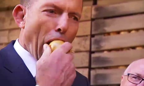 Tony Abbott eats a whole raw onion