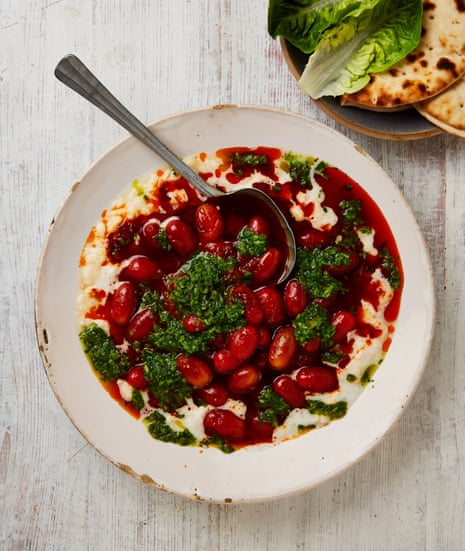 Chantelle Nicholson’s vegan recipe for harissa-marinated tomatoes with broken butter beans and herb relish.