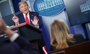 Donald Trump and reporters at the daily coronavirus briefing at the White House on 13 April.