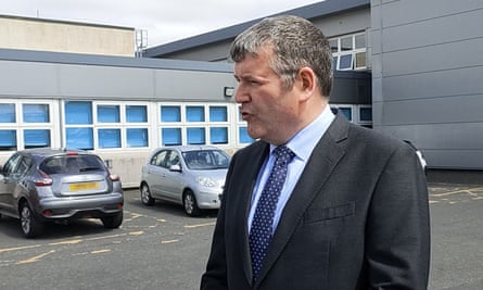 The headteacher of St Kentigern’s academy, Andrew Sharkey, making a statement outside the school in Blackburn, West Lothian