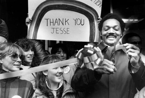 Jesse Jackson cuts a ribbon to open his campaign headquarters in Manchester, New Hampshire, on 7 January 1984.