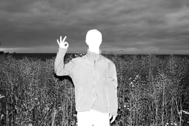 A whited out figure in a corn field