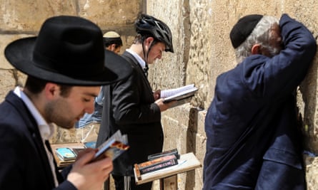 Jews praying by the Western Wall.