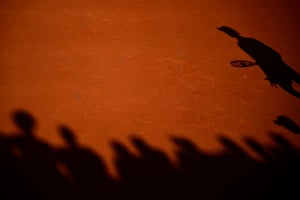 The shadows of spectators and Hamad Medjedovic (right) are seen during his match against Daniel Altmaier